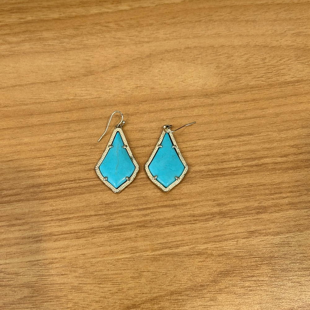 Kendra Scott gold earrings with turquoise stone
